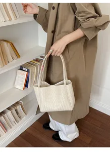 Retro woven tote bag for women, chic leather shoulder handbag, large capacity commuter bag.
