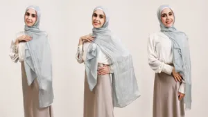 Detailed view of glossy crinkled satin hijab, smooth drape, elegant fabric texture for women.