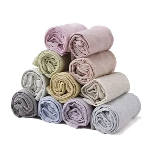 Close-up detail showing rolled pastel arm sleeves, soft modal fabric texture and elastic stack.