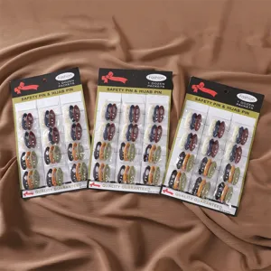 Colorful plastic hijab safety pins set with rhinestones, 12 dozen packets per card display.