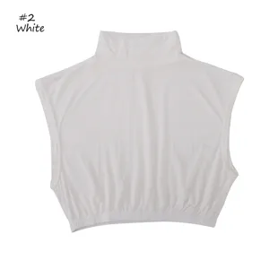 Close-up view of the solid white sleeveless mock turtleneck fake collar, showing soft fabric details.