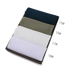 Solid color crinkled scarf detail view showing four color options in a neat tray display.