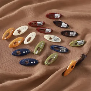 Colorful plastic safety pins with hollow star and rhinestones, versatile clothing accessories.