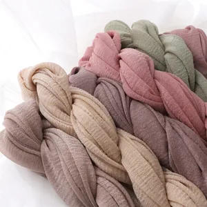 Detailed view of soft solid crinkle long scarves, lightweight breathable polyester fabric.