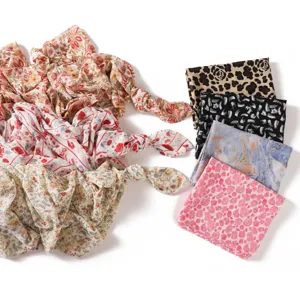 Chiffon printed scarf detail showing floral and leopard patterns, soft and breathable fabric.