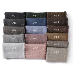 Detailed view of solid color textured fringe scarves in multiple color options for autumn.