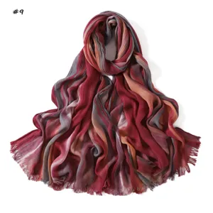 Gradient rayon crinkle scarf detail showing soft fabric texture and elegant fringe edges.