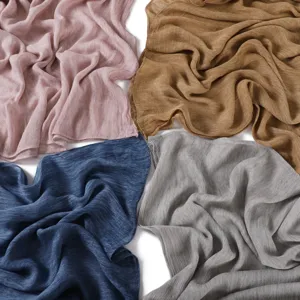 Detailed view of soft modal pleated solid color scarves, breathable fine-grained fabric texture.