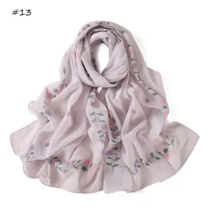 Detail view of the floral printed chiffon scarf, lightweight spring summer women fashion accessory.