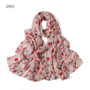 Detailed view of lightweight floral chiffon scarf with red stripes, soft and elegant accessory.