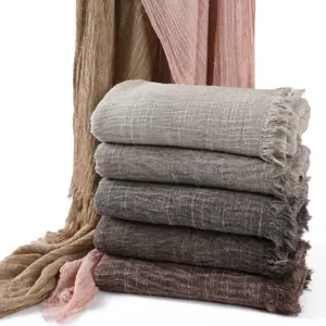 Detailed view of women casual vintage crinkled solid color tassel scarves collection.