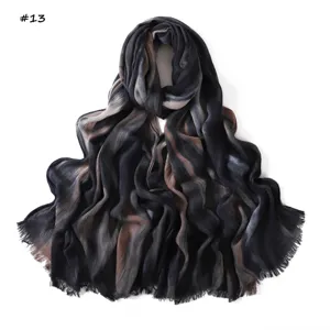 Detailed view of the gradient wrinkled rayon scarf showing soft texture and delicate fringe trim.