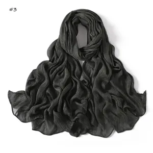 Detail view of the soft crinkled rayon scarf texture, lightweight and breathable fabric.