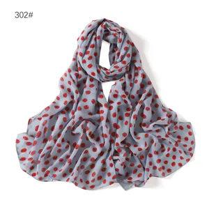 Lightweight blue chiffon scarf featuring a stylish red polka dot pattern for women.