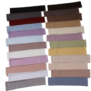 Close-up details of assorted colorful solid ice silk arm sleeves displayed neatly for color choice.