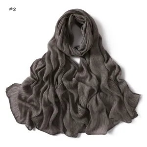 Solid color wrinkled rayon long scarf with rolled edges, breathable soft draped detail.