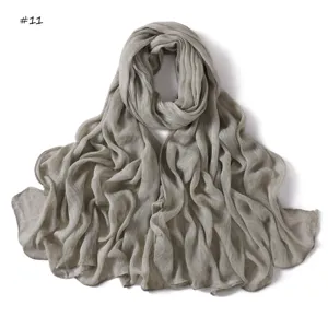 Grey crinkled cotton scarf detail, lightweight breathable fabric with rolled hem edges.
