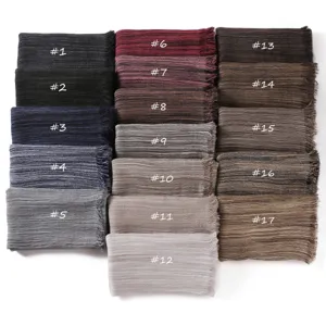 Detail view showing multiple color options of the soft pleated fringe cotton blend scarf.