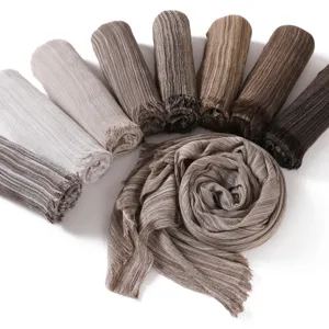 Retro striped wrinkled scarf detail, soft cotton linen texture with stylish fringed edges.