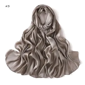 Detailed view of the soft satin long scarf with elegant wide stripes and smooth texture.