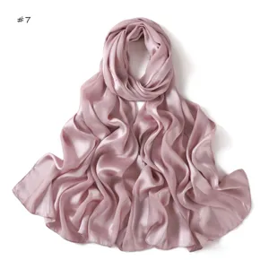 Pink satin silk long scarf detail, smooth breathable texture, elegant draped fashion accessory.