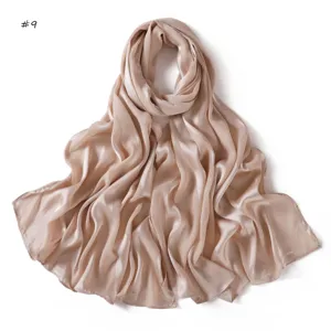 Detail view of the soft satin silk scarf showing smooth texture and elegant drape effect.