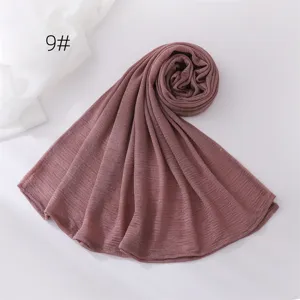 Detailed view of the solid color crinkle hijab scarf in dusty rose, lightweight polyester.