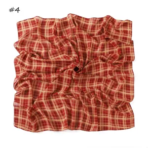 Red beige plaid chiffon square scarf detail, lightweight translucent fabric texture display.