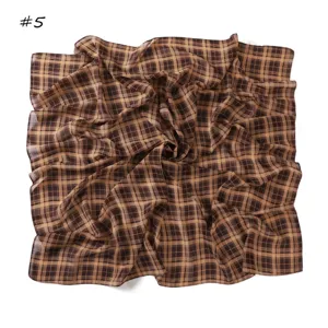 Detailed view of the vintage brown plaid chiffon square scarf, soft fabric close-up.