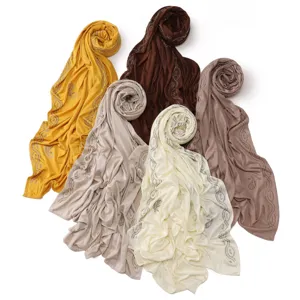 Rhinestone embellished jersey hijab detail view showing exquisite border pattern and soft fabric texture.