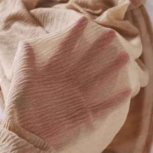 Detail shot showing the lightweight sheer texture and crinkle design of the solid color scarf.
