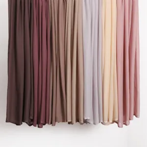 Soft modal rayon fabric detail of wide long scarf shawl in various elegant solid colors.
