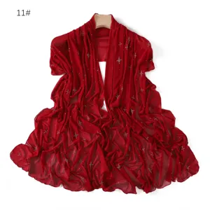Red elastic mesh scarf with rhinestone star details, soft breathable thin shawl detail.