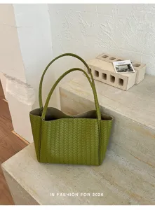 Women's green woven leather tote bag, stylish large capacity shoulder handbag for commuting.