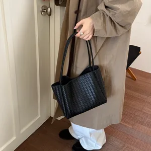 Black woven leather tote bag for women, classic intrecciato design, stylish large capacity.
