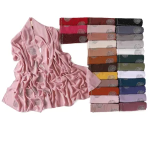 Chiffon hijab scarf detail showing rhinestone rose pattern and multiple color options.
