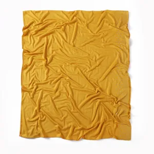 Close-up detail of soft yellow mercerized cotton scarf with sparkling rhinestone edge.