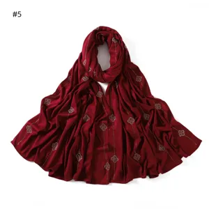 Detailed red mercerized cotton long scarf featuring rhinestone four leaf clover motifs and lines.