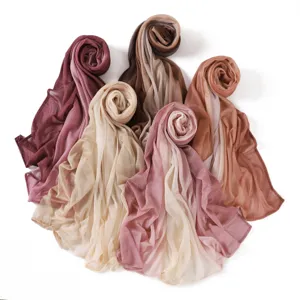 Gradient crinkle scarf detail showcasing soft lightweight texture and elegant color transitions.