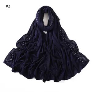 Detailed view of dark blue long jersey scarf with sparkling side rhinestone embellishments.