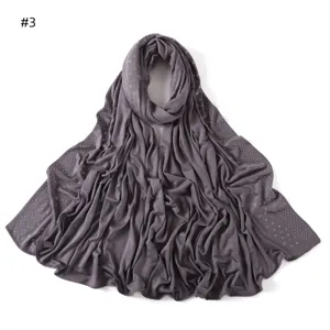 Detail view of solid dark grey mercerized cotton jersey long scarf with sparkling rhinestones.