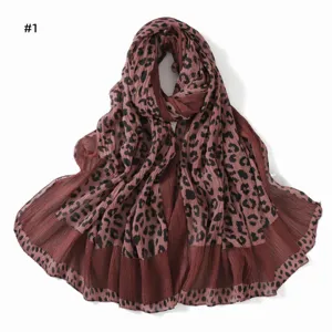 Detailed view of the vintage pleated leopard print scarf, showing fine texture and soft fabric.