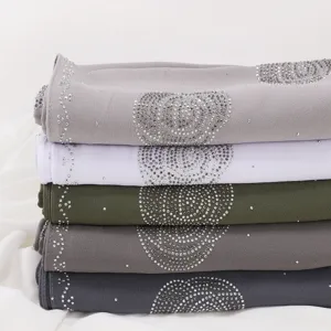 Premium chiffon rhinestone hijab shawl detail, featuring sparkling crystals and elegant drape.