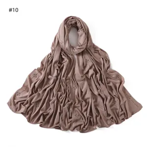 Brown modal jersey hijab scarf featuring sparkling rhinestone clover patterns for women.