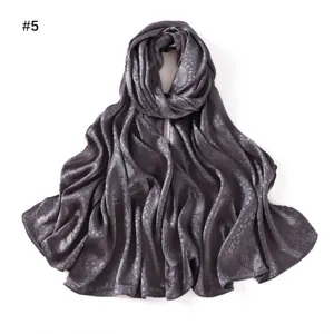 Dark grey satin silk scarf with elegant leaf jacquard pattern, soft and breathable drape.