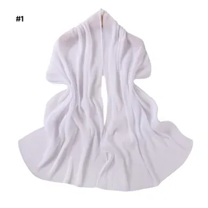 Detailed view of the elegant solid white pleated chiffon scarf with subtle metallic shimmer.