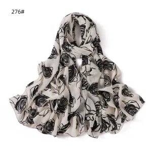 Close-up detail of white and black rose printed chiffon long scarf, lightweight and breathable.