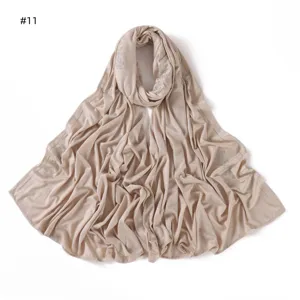Solid mercerized cotton hijab with rhinestone floral details, soft and breathable.