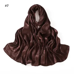 Dark brown satin leaf jacquard long scarf fabric detail showcasing soft shiny texture.