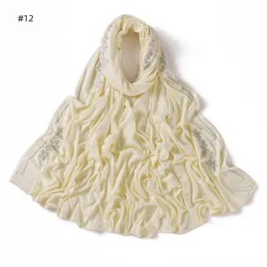 Light yellow rhinestone embellished cotton jersey scarf detail, soft and elegant shawl.